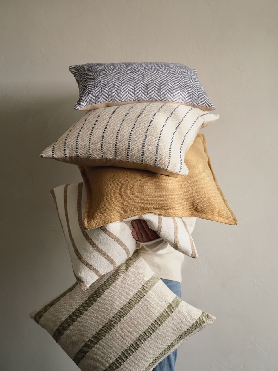 Soft cushions styled in a considered everyday interior