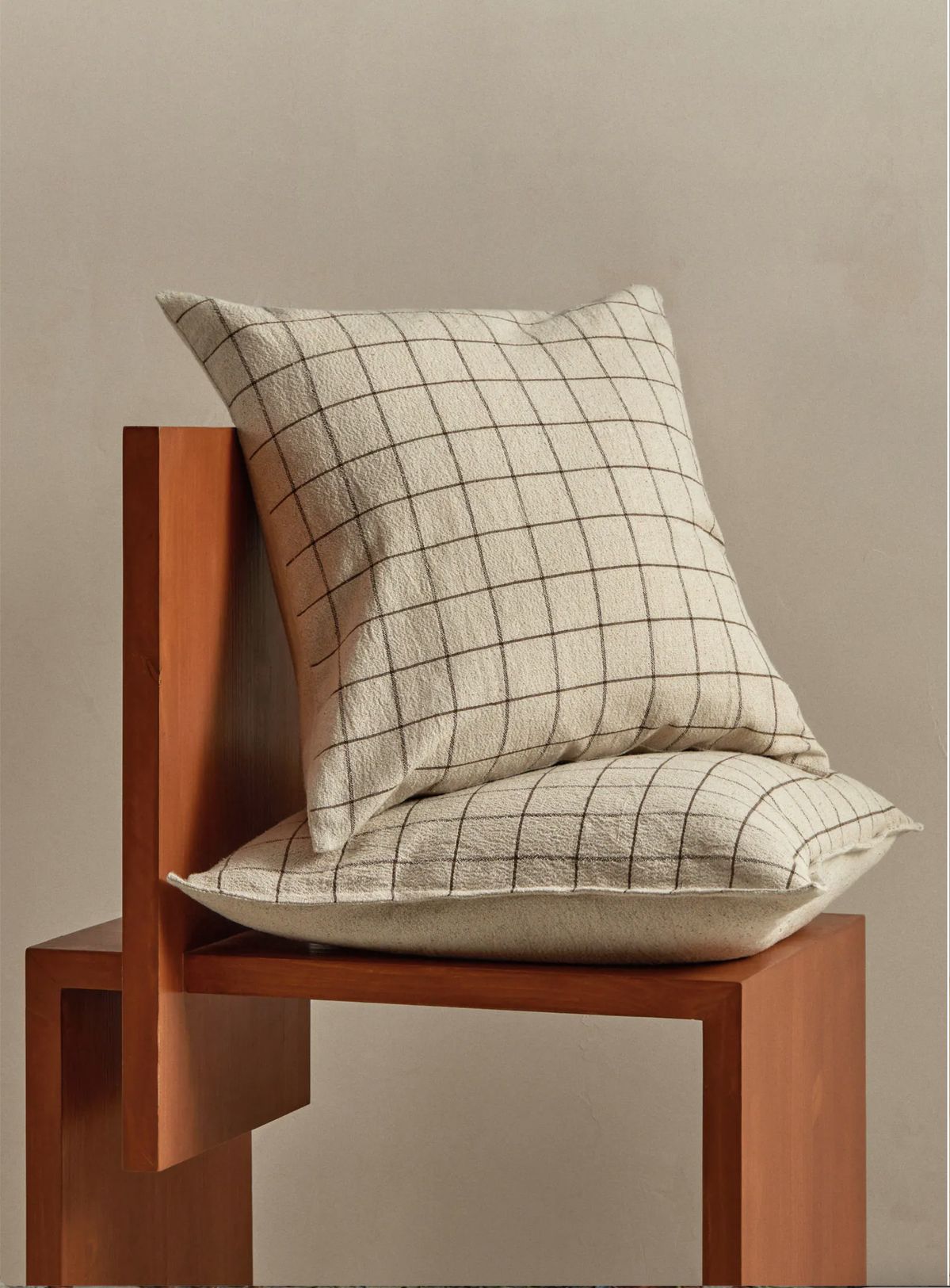 Textiles layered naturally in an everyday interior